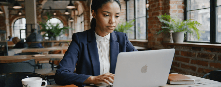 Female architect participates in AIA online course in office.