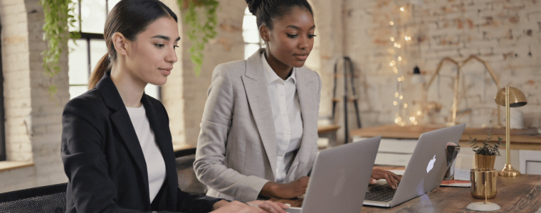 Two women architects take AIA webinar.